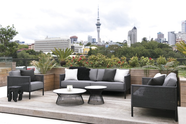 The apartment has expansive city views. The outdoor furniture is from Design Warehouse.