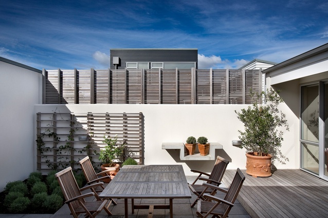 Courtyards are screened for privacy. Boardwalk Lane, Seatoun.