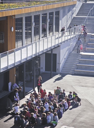 Wide balconies become spaces for socialising and learning.