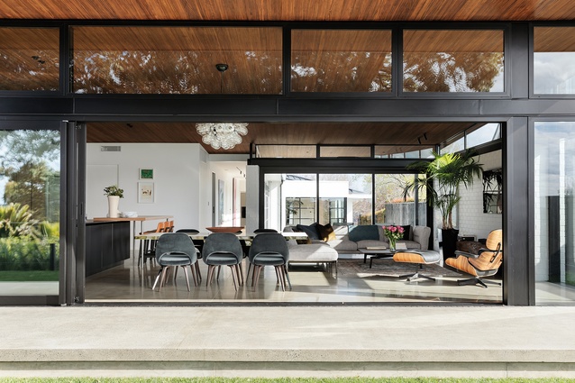The material rawness throughout the main pavilion is countered by dark-timber ceilings and elm cabinetry in the kitchen. The <a 
href="https://www.studioitalia.co.nz/products/adda"style="color:#3386FF"target="_blank"><u>Adda corner sofa</u></a> from Flexform and <a 
href="https://www.studioitalia.co.nz/products/Poliform-tribeca-coffee-table"style="color:#3386FF"target="_blank"><u>Tribeca coffee table</u></a> from Poliform complete the living area.