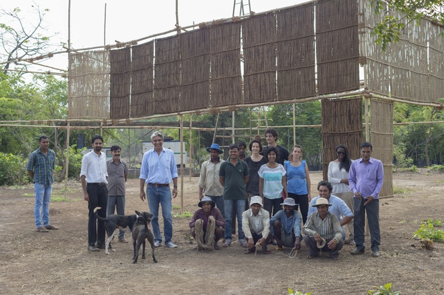 Architect Bijoy Jain and a team of craftspeople with a full-scale prototype of the 2016 MPavilion designed by Studio Mumbai.