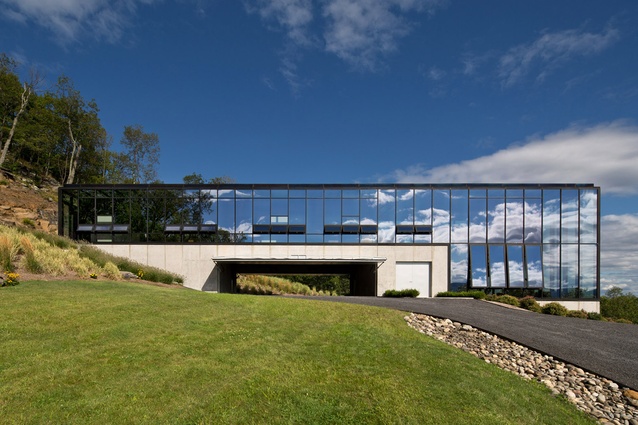 Shokan House in rural New York by Rafael Viñoly Architects. This glass box home reflects the scenic landscape and offers expansive views of the lake and surrounding hills.