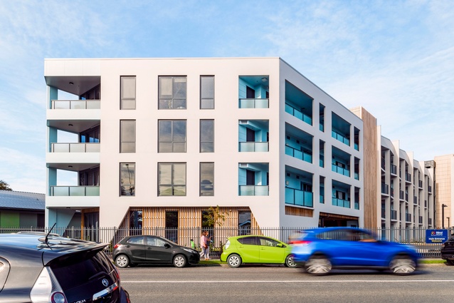 Timber fins and pale blue façades soften the structure. This colour wasn’t incidental. Research shows soft blue tones promote calm and support wellbeing.
