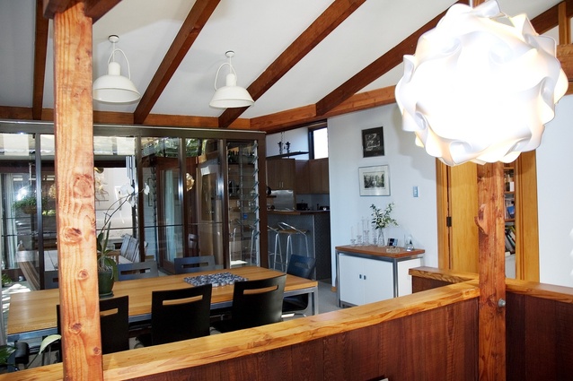 A view of the dining room through to the kitchen and door to study.