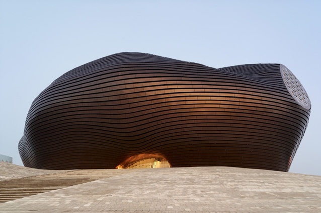 Ordos Art & City Museum, Mongolia, 2011 by MAD Architects. In the Gobi desert, the museum is clad in polished metal tiles that are resistant to frequently occurring sandstorms.
