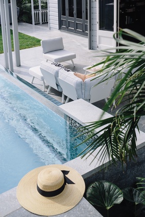 The inviting azure waters of the above-ground pool. Modular seating from Citta Design’s Pop outdoor furniture.
