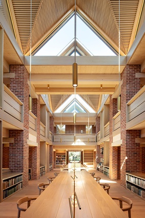 The New Library, Magdalene College in Cambridge by Níall McLaughlin Architects. The space includes grand large communal tables.