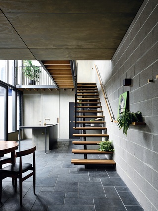 The architects brought typically exterior materials into the interior, such as the split bluestone pavers.