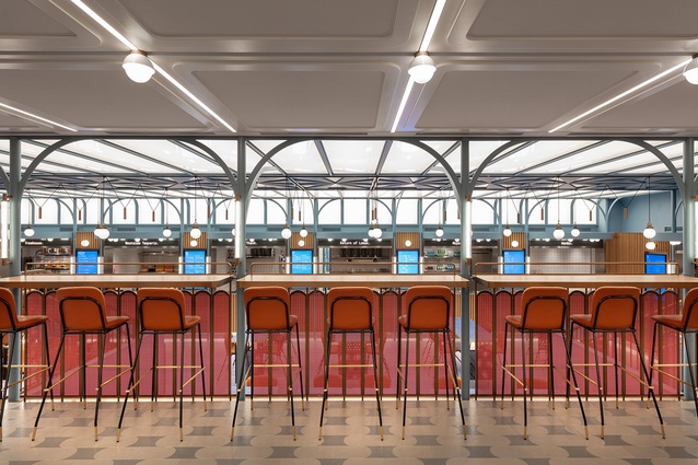 "The custom metal canopy ceiling is a highlight of the [lower] space and references traditional vaulted market hall structures," Linehouse notes.