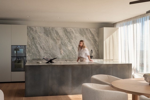 Morning sun casts a soft glow on the subtle pastel tones of the zinc-clad island bench and the quartzite stone splashback. 