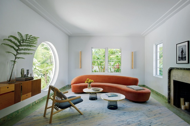 The sitting room uses transparency, eclecticism of materials and colour to hint at the nouveau tropical interior.