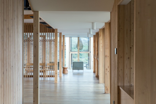 Vertical timber is a striking feature of the interiors of both the main community building and the Aro Hã building. 