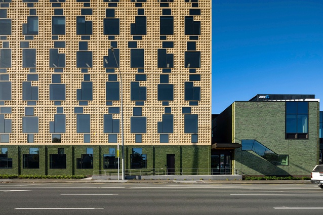 A masterful and jaunty play of shape, colour and texture is evident in the project — the building's expression reflecting the historic pūriri forests of the area.