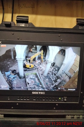 Remote excavator at work removing the debris from the nave floor, as seen from the remote operators monitor.