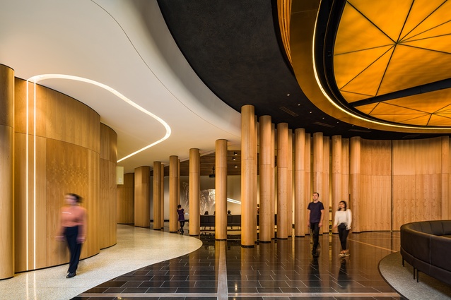 Nautilus-shell-inspired, tawa-veneer columns serve as a backdrop to the tanoa where they become pivoting double doors in the centre (on right) as well as lining one of the new north-south pathways (on left).