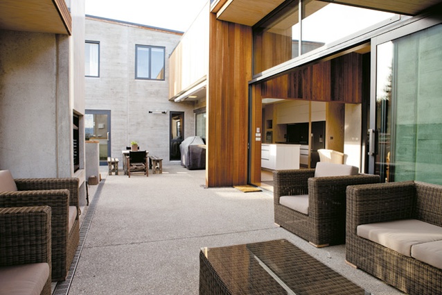 The large sheltered courtyard has room for an outdoor lounge and dining area.