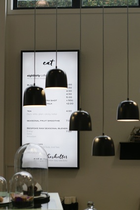 A variety of hanging pendants of different lengths bring interest to the café.