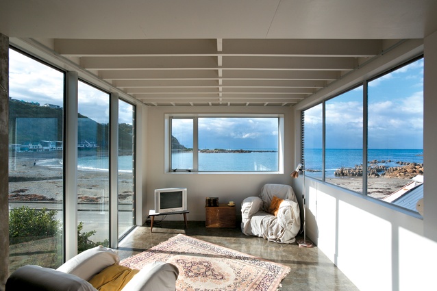 The living room on the first floor looks over the street and across the bay to Cook Strait.