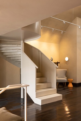 A modern industrial circular stairwell, adds old school charm to a third meeting area.