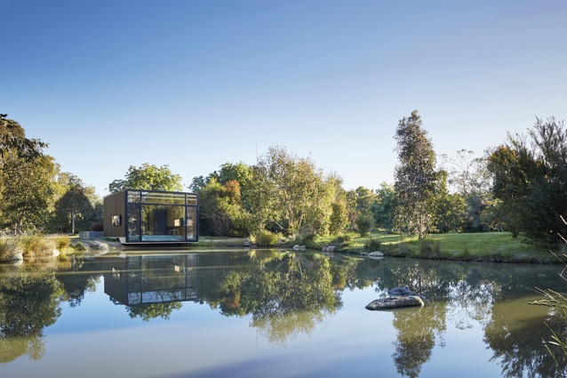 The tranquil retreat sits on the banks of the pond where it has a constant connection to nature, and reflected light dapples the interior space. 
