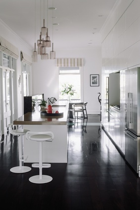 The orientation of the kitchen means the eye travels both to the dining area and out of the backyard.