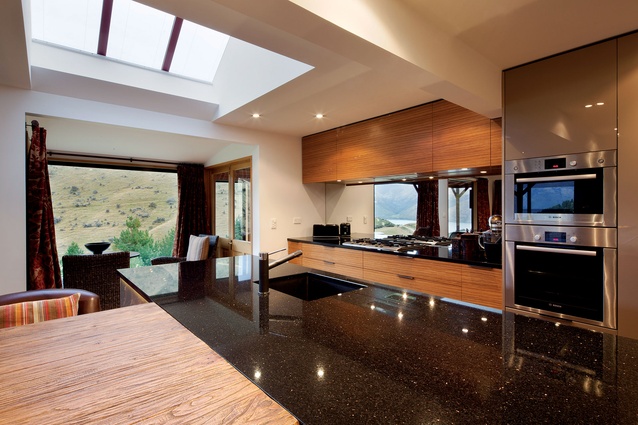 High-gloss mixed with matte finishes creates a kitchen with both contemporary and classic elements.