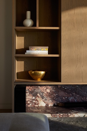 Bespoke timber-veneer cabinetry features throughout the interior spaces.