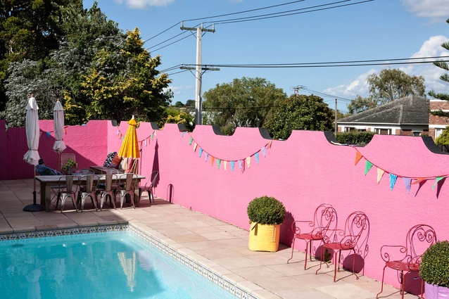 Mexican-pink walls liven up the pool area.