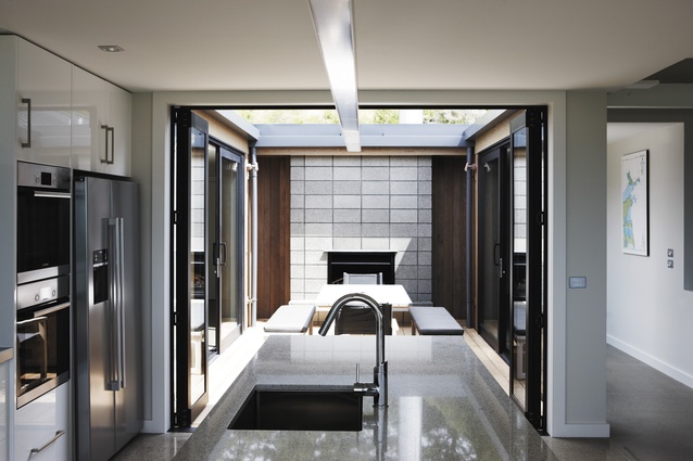 The kitchen opens up onto an internal courtyard for completely sheltered dining.