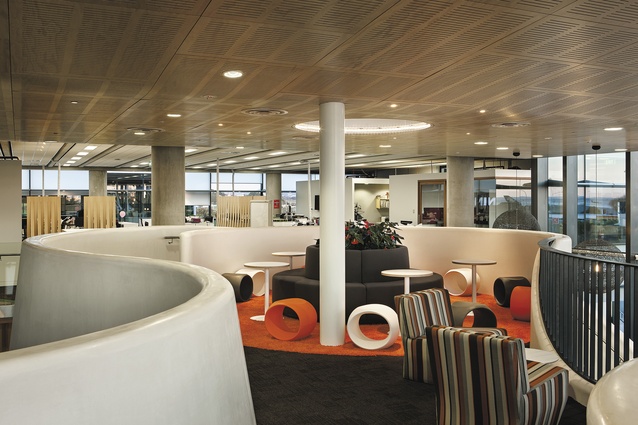 View towards the landing, an informal meeting area that looks out over the double-space void above the café. Plenty of provision has been made for informal meetings, with high-backed sofas being one device utilised.