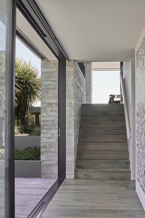 The home's three levels blur and blend, united by an exterior palette that anointed in-situ concrete.