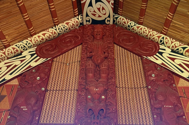 Pou Tuarongo (back wall-pillar of a meeting house) at Takipū Marae, with the carved figures of many paramount tīpuna (ancestors): notably, at the uppermost point, is Sir Āpirana Ngata.
