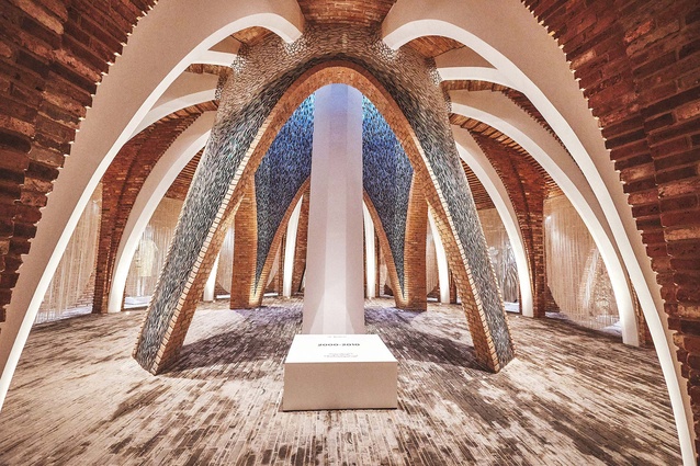 Vaulted arches and cloisters feature throughout, lined with reclaimed bricks and mosaics.