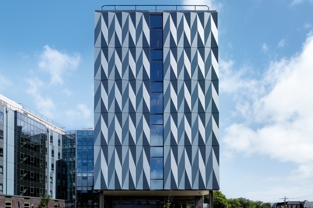 The building’s most overt cultural component is its façade of aluminium panels folded into a kaokao pattern.