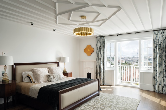 Above the bed in the main bedroom is a <a 
href="https://ecc.co.nz/lighting/indoor/pendants-chandeliers/carousel"style="color:#3386FF"target="_blank"><u>Carousel pendant light</u></a> by Lee Broom. A fireplace, discovered during the renovation, is nestled in one corner.