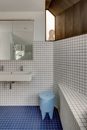 Bold blue and white tiles accentuate the unusual lines.