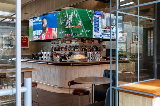 A central bar with wraparound screens ensures sports fans don’t miss a moment.