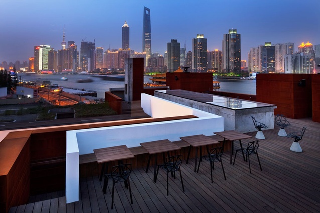 Roof deck with view of Shanghai skyline.
