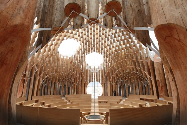 Light of Life Church, South Korea by shinslab architecture + IISAC. The circular worship space utilises a multitude of red cedar trunks to create a stunning "interior universe".