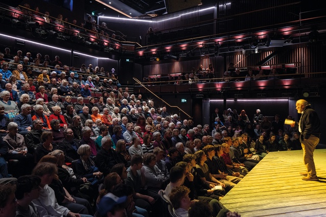 The auditorium’s multilevel courtyard
format increases intimacy by “papering the walls with people”.