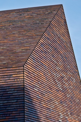 The renovation and expansion of Sorø Art Museum. Simple building forms are coated with specially formulated brick shells, which relate to the traditional masonry. 
