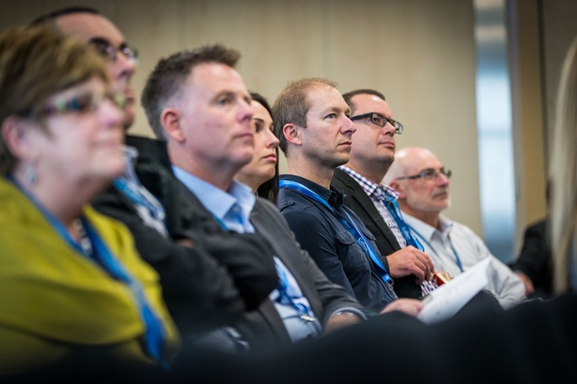 Corporate real estate and industry professionals listen intently during the keynote speeches.