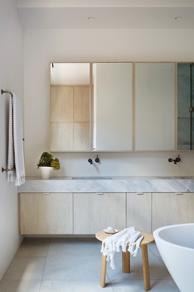 Clean lines and subtle textures characterize the bathroom interiors, ushering in a sense of calm.