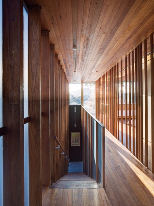 Tactile timber-lined spaces create a “cinematic” experience throughout the home’s interior.
