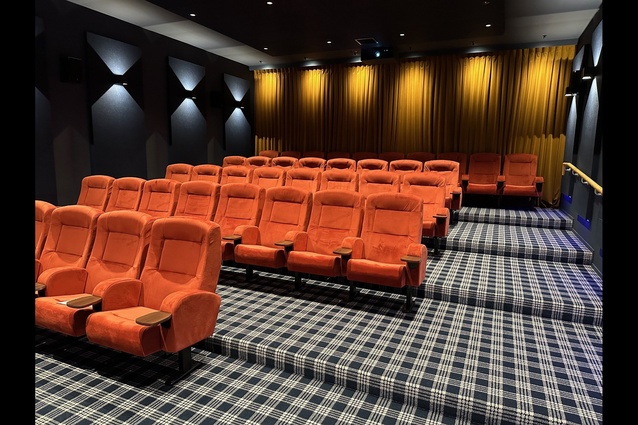 The deluxe cinema facility features a luxurious plaid-patterned woven carpet, with its wool and synthetic fibre blend ensuring resilience.