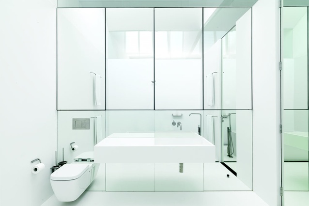 The bathroom interior, with walls, basin and floor made from Corian.
