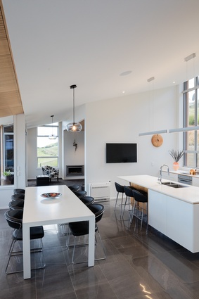 The kitchen/dining area has views to the front and back and enjoys cross ventilation.