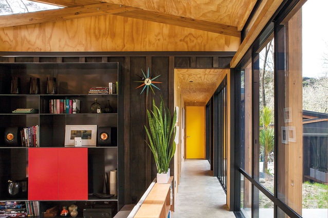 Easterbrook House. Built-in furniture saves space and injects pops of colour.