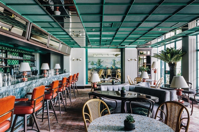 French restaurant Louise is a smorgasbord of floral patterns and furniture arrangements inspired by the tropics.