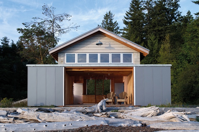 American architectural studio Hoedemaker Pfeiffer created a waterside cabin out of this existing boathouse in Puget Sound in Washington.